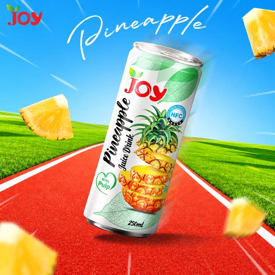 JOY pineapple drink with pineapple fruit in a colourful setting